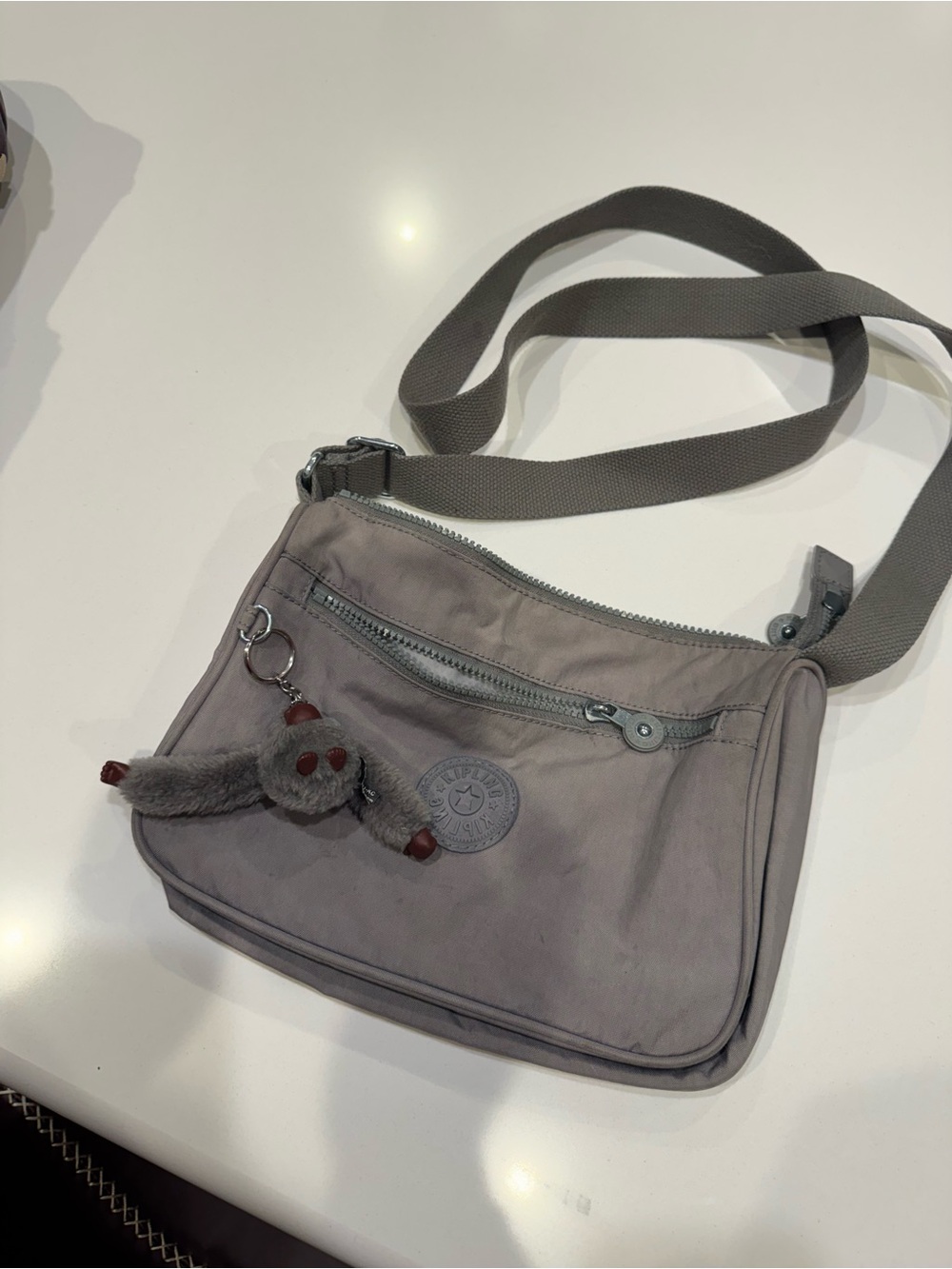 Kipling Taupe Gray Crossbody Bag with Plush Monkey Charm